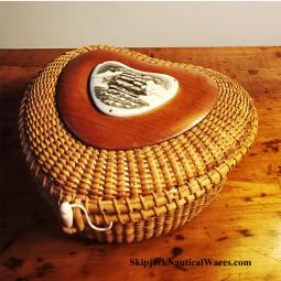 An exquisitely made heart-shaped Nantucket-style lidded basket.  Features heart-shaped bone scrimsha