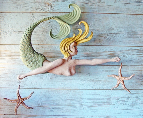 "Mermaid with Starfish" folk art carving by J & P Johnson -- length 34"