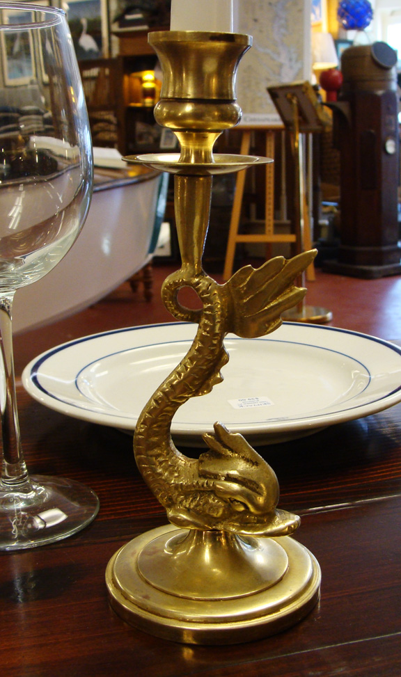 Early 20th Century Brass Dolphin/ Serpent Candlesticks. closeup of candlestick