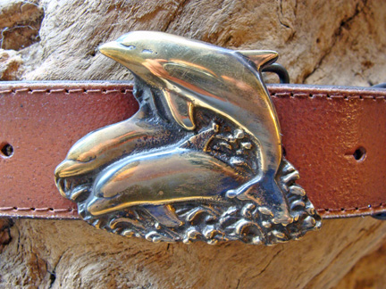 https://www.skipjackmarinegallery.com/mm5/graphics/00000001/MMDBB_leaping_dolphins_brass_belt_buckle_marine_coastal_reg.jpg