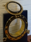 Brass Door Porthole With Adjustable Flange, shown with porthole open
